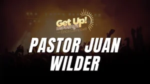 Get Up! Mornings with Erica Campbell show graphic featuring Pastor Juan Wilder name over silhouetted crowd with raised hands and golden sun logo.