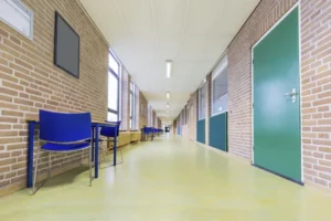 Straight long and abandoned corridor in high school