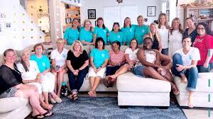 A large group of women in a living room