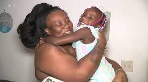 Mother and daughter hugging