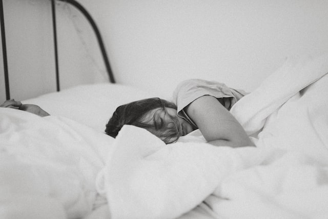 A lady laying in bed asleep