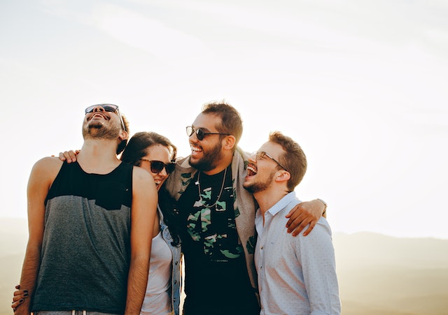 A group of four friends laughing